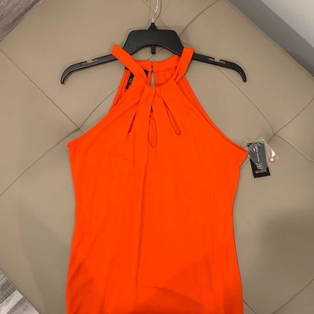 INC, Orange tank. Cut out design around chest area buttons back of neck.
